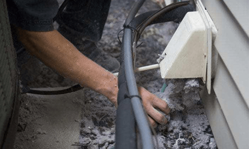 A person working on a dryer vent system