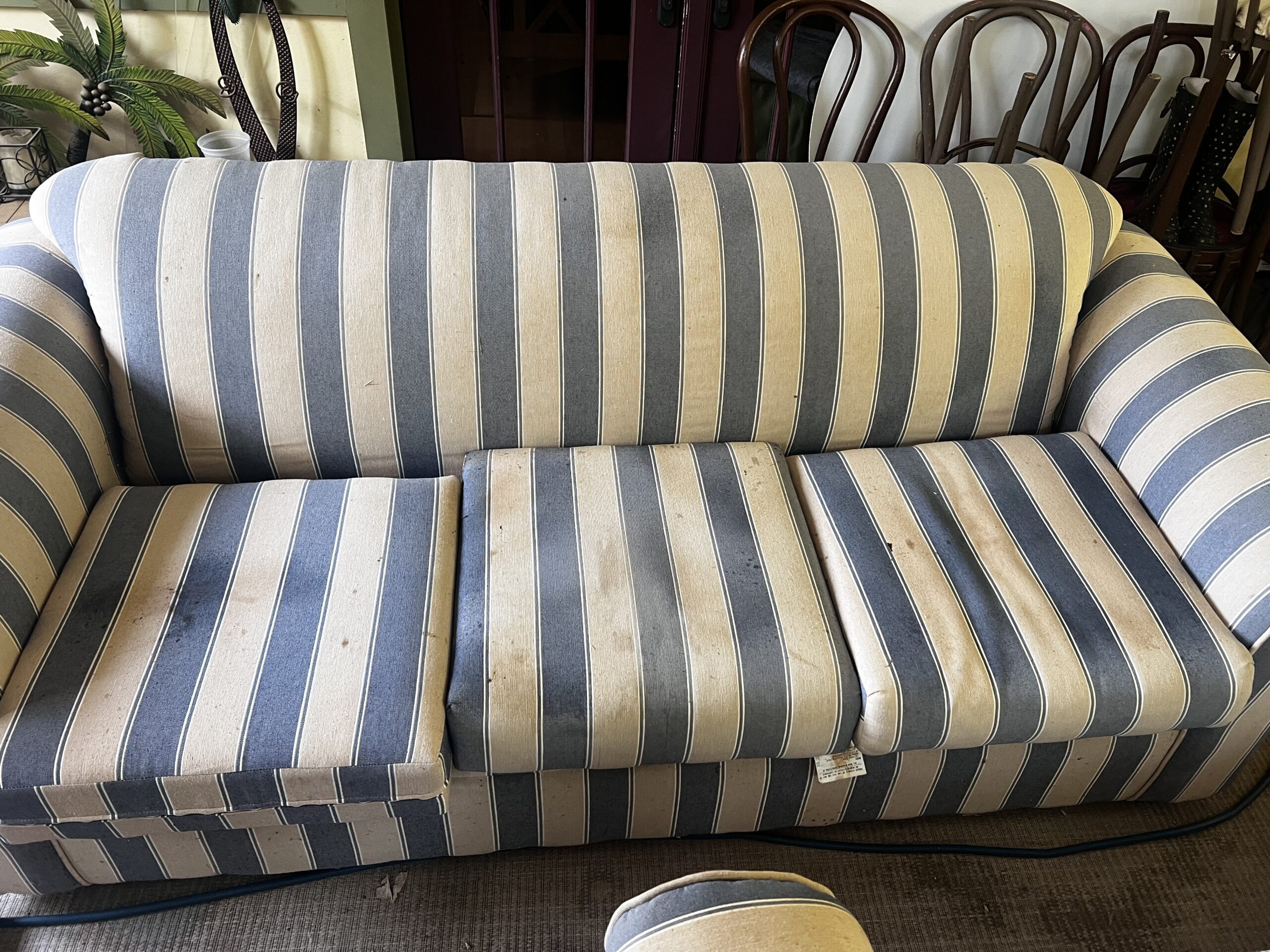 Striped three-seater fabric sofa.