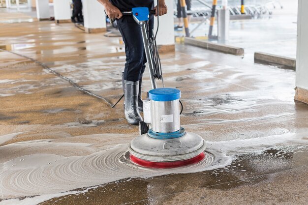 Professional floor cleaning with industrial machine.