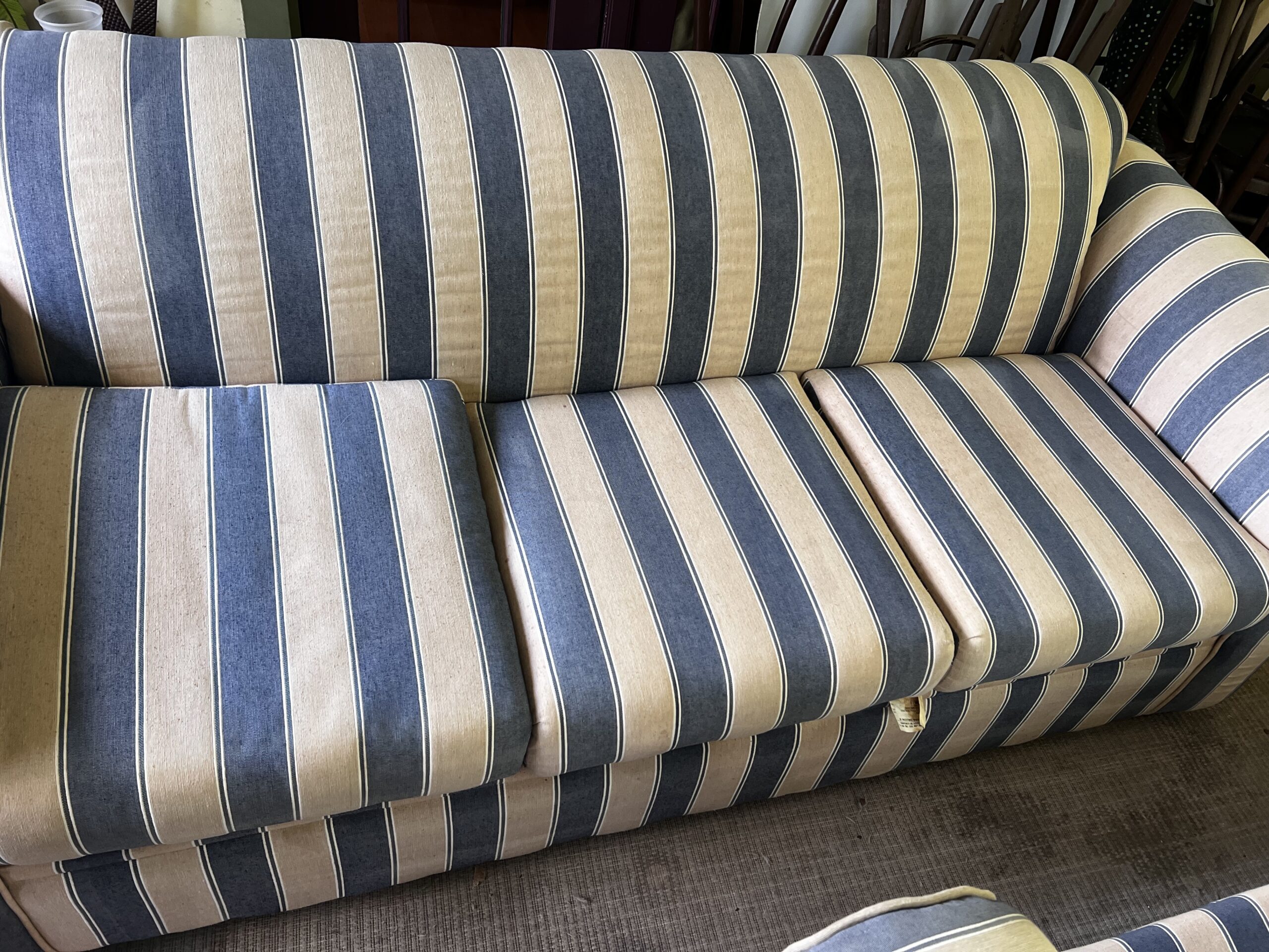 This is a blue and beige striped fabric sofa