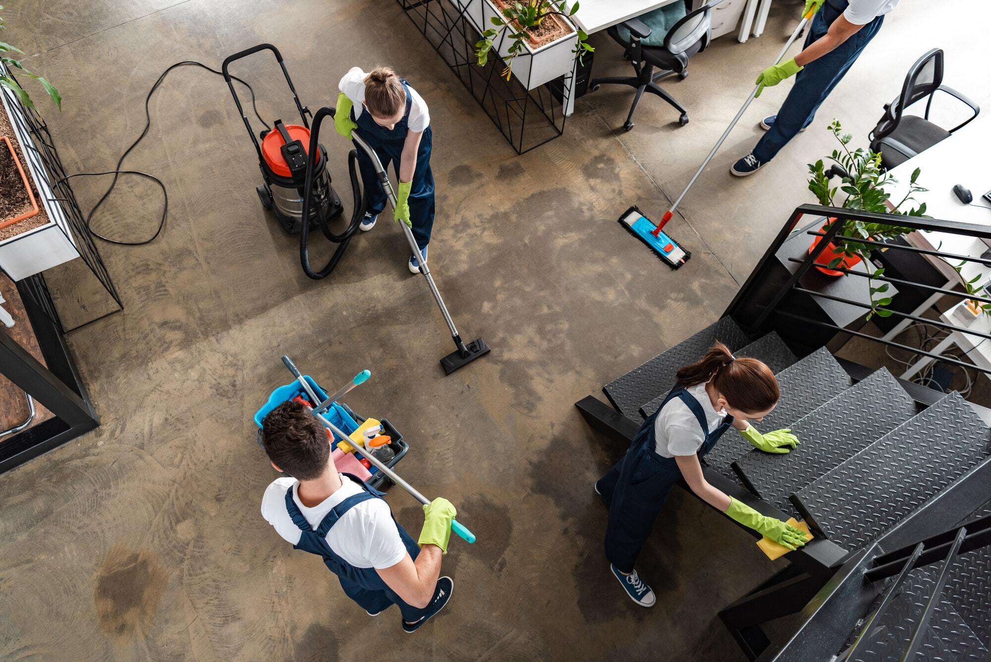 Team of cleaners performing commercial cleaning services